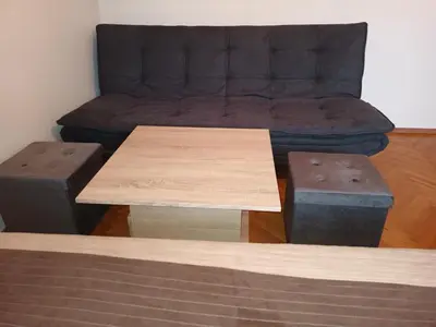 a living room with a couch and a table at Apartment Carmen in Brezje