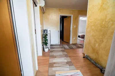 an empty hallway with a hallway leading to a room at Apartment Carmen in Brezje