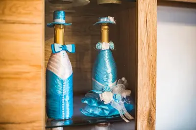 two blue glass bottles sitting on a shelf at Apartment Carmen in Brezje