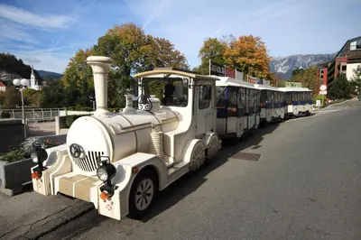 an old train is parked on the side of the road at Čarman House in Bled