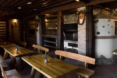 a dining room with wooden tables and chairs at Houston Resort in Radovljica