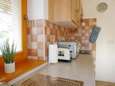 a kitchen with a sink and a microwave at Apartment Jalps 1 in beautiful Bohinjska Bistrica in Bohinj