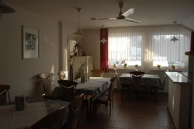 a kitchen and dining room with a table and chairs at Guest Accomodation Škerlak in Moravske Toplice