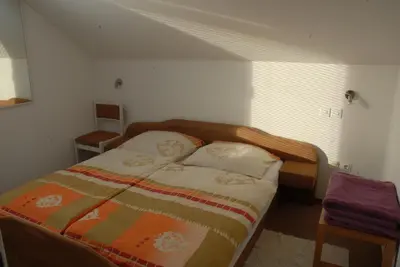 a bedroom with a bed in a room at Guest Accomodation Škerlak in Moravske Toplice