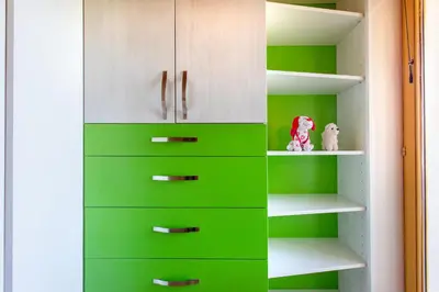 a green closet with white cabinets and shelves at Quiet family house Butterfly place in Dob