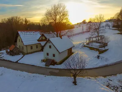 an aerial view of a house in the snow at Tourist Farm Rajšp in Benedikt v Slovenskih Goricah