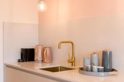 a kitchen counter top with a sink and a sink at La Villa Ljubljana in Ljubljana