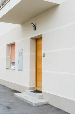 a door on the side of a building at Kamr’ca in Ljubljana