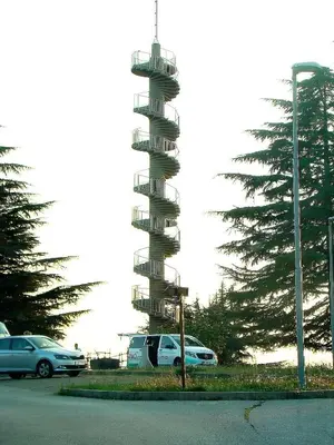 a parking lot with a tower with cars on it at Apartmaji Nena in Ročinj
