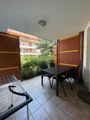 a patio with a table and chairs on a balcony at Apartma Ajda in Moravske Toplice