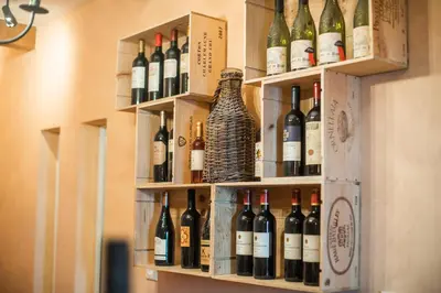 a bunch of bottles of wine on a wall at Villa Zupan with Hot Tub in Škocjan