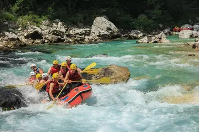 a group of people in a raft in a river at Hostel X Point in Kobarid