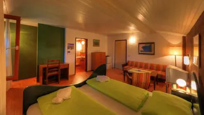 a living room with a couch and a table at Guesthouse Marko in Bled