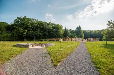 a path through a field with a skate park at Glamping Krone Kolpa Heaven in Adlešiči