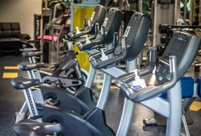 a row of exercise bikes in a gym at WUD hotel in Ljubljana