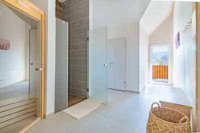 a hallway with a wicker basket in a house at Deluxe apartments Bled in Bled