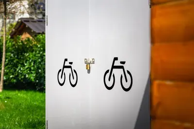 a white sign with two bikes on it at Deluxe apartments Bled in Bled