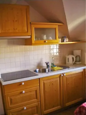 a kitchen with a sink and a counter top at APARTMA PR TAVČARJU in Zgornje Gorje