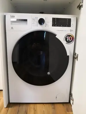a white microwave oven sitting in a room at Bonito apartment in Postojna