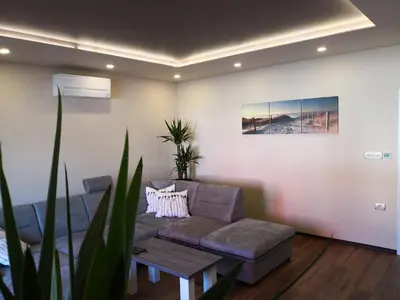 a living room with a couch and a table at Bonito apartment in Postojna