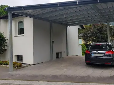 a car parked in a parking lot in front of a building at Apartment Dolce Vita in Celje