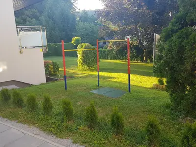 a playground in a yard with at Apartment Dolce Vita in Celje