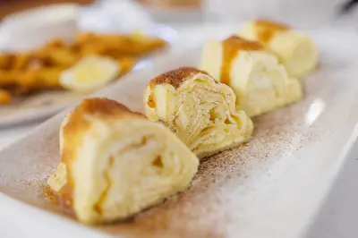 a group of bread on top of a plate at Pri Žabarju Bed & Breakfast Ljubljana in Ljubljana