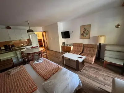 a living room with a couch and a table at Apartman Veriga in Kranjska Gora