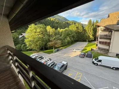 a balcony with a view of a parking lot at Apartman Veriga in Kranjska Gora