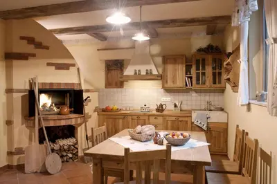 a kitchen with a table with a bowl of fruit on it at Alpine Homestead in Goreljek