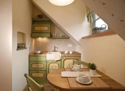 a kitchen with a wooden table and a sink at Alpine Homestead in Goreljek
