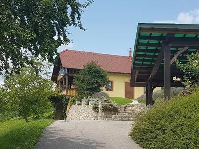 a house with a stone path in front of it at Holiday Home Mirt with HotTub & Sauna in Blanca