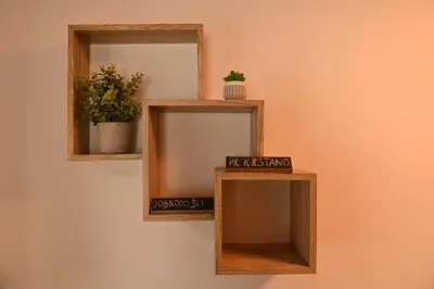a mirror on a wall with two wooden shelves at Apartments Pr'Krštano in Kranjska Gora