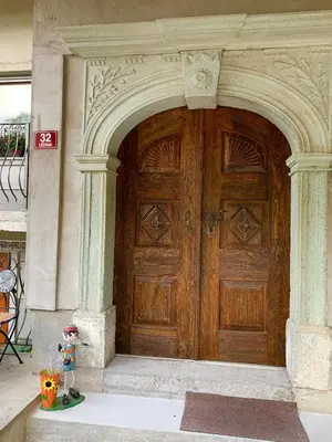 an entrance to a wooden door to a building at STATUS Apartments in Bled