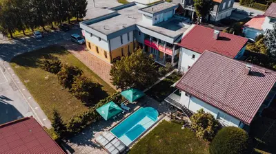 an overhead view of a house with a swimming pool at Vila Anna in Radenci