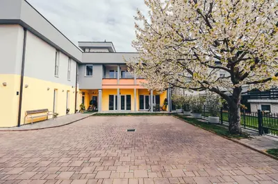 a brick driveway in front of a building at Vila Anna in Radenci