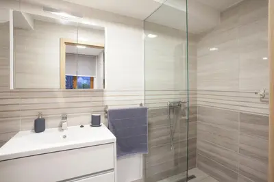 a bathroom with a sink and a glass shower at Studio Jan in Zgornje Gorje