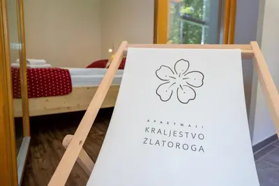 a sign for a hotel room with a clover on it at Bohinj Apartments Goldhorn Kingdom in Bohinj