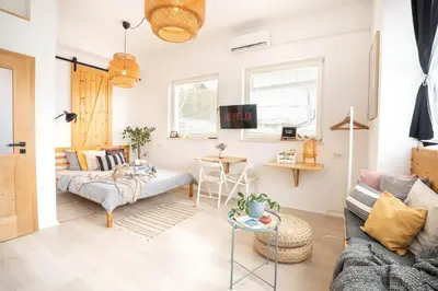 a living room with a couch and a table at Funky soul studio in Žirovnica