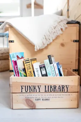 a wooden box filled with books on a table at Funky soul studio in Žirovnica