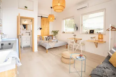 a living room with a couch and a table at Funky soul studio in Žirovnica