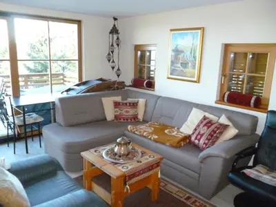 a living room with a couch and a table at Chalet Bellevue Rogla in Zreče