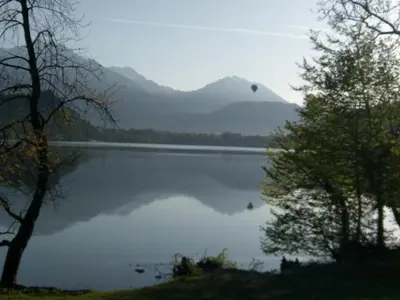 a view of a lake with mountains in the background at Apartment Jacobs in Bled