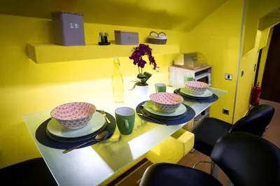 a table with three bowls and plates on it at Apartment Jacobs in Bled