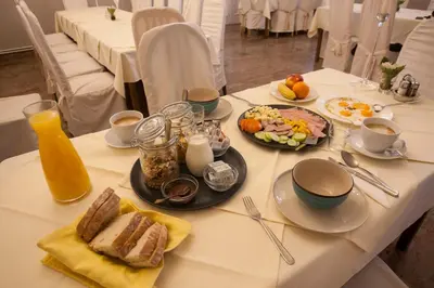 a white table with breakfast foods on it at Guest House Čelan in Spodnja Hajdina