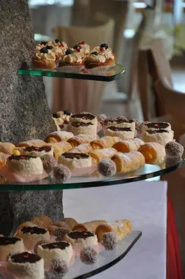 a display of different types of pastries and donuts at Guesthouse Dolinsek in Sevnica