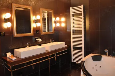 a bathroom with two sinks and a tub at Guesthouse Dolinsek in Sevnica
