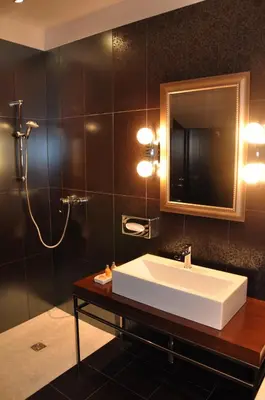a bathroom with a sink and a mirror at Guesthouse Dolinsek in Sevnica