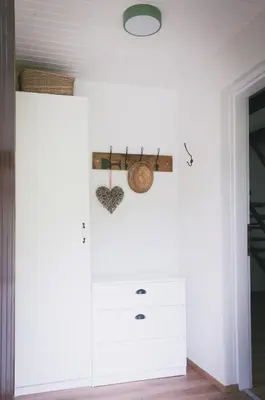 a room with a white cabinet and a door at NATURALINA HOLIDAY HOUSE in Tribussa Superiore