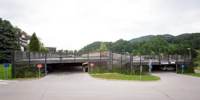 a bridge over a parking lot with a road at Terme Olimia - Hotel Breza in Podčetrtek